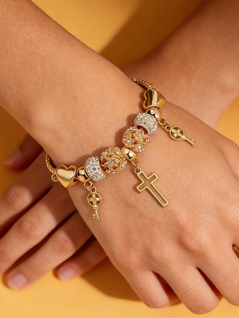 Anthropologie Gold-Tone Charm Bracelet with Cross and Key Drops